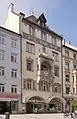 Neugotischer Walmdachbau mit reicher Natursteingliederung und rippengewölbter Loggia in prächtigem Erker, von Max Ostenrieder, 1899