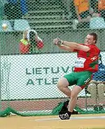 Image 8Yury Shayunou spinning with the hammer within the circle (from Track and field)